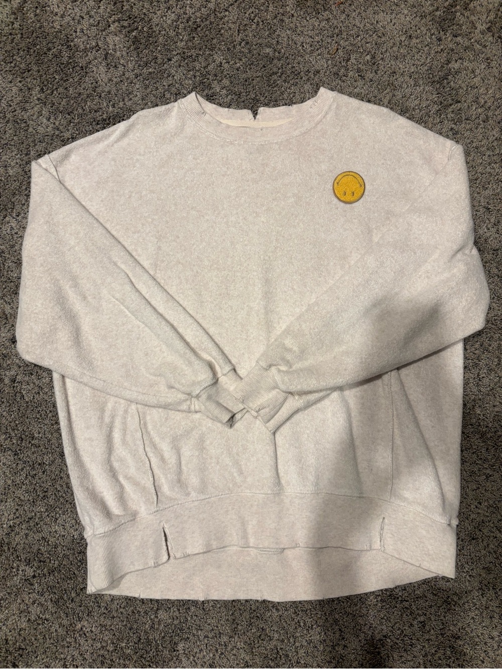 aerie cream textured sweatshirt with upside down smiley face